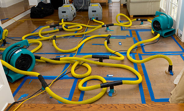 Professional Flood Damage Restoration technician working in New Castle, NH